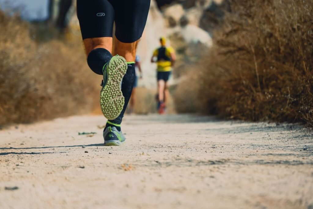 Close-up of running shoes on a trail