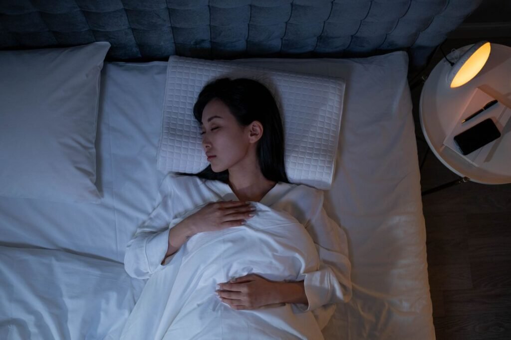Person sleeping peacefully representing better sleep quality