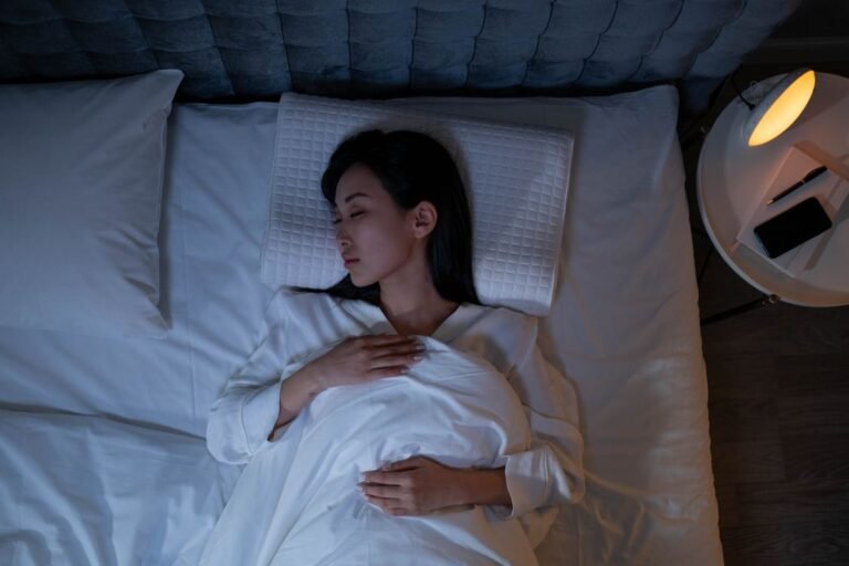 Person sleeping peacefully representing better sleep quality