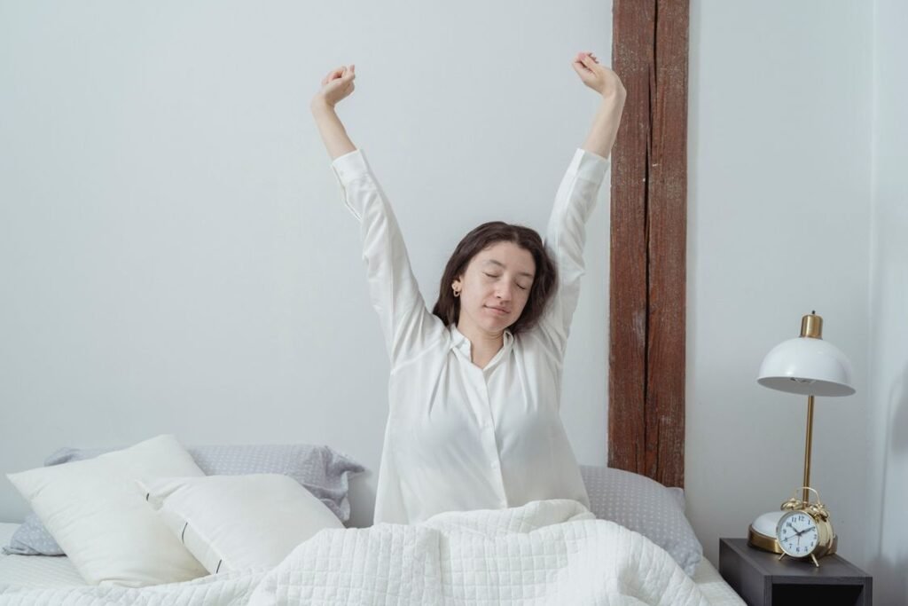 Woman stretching after waking up — morning recovery